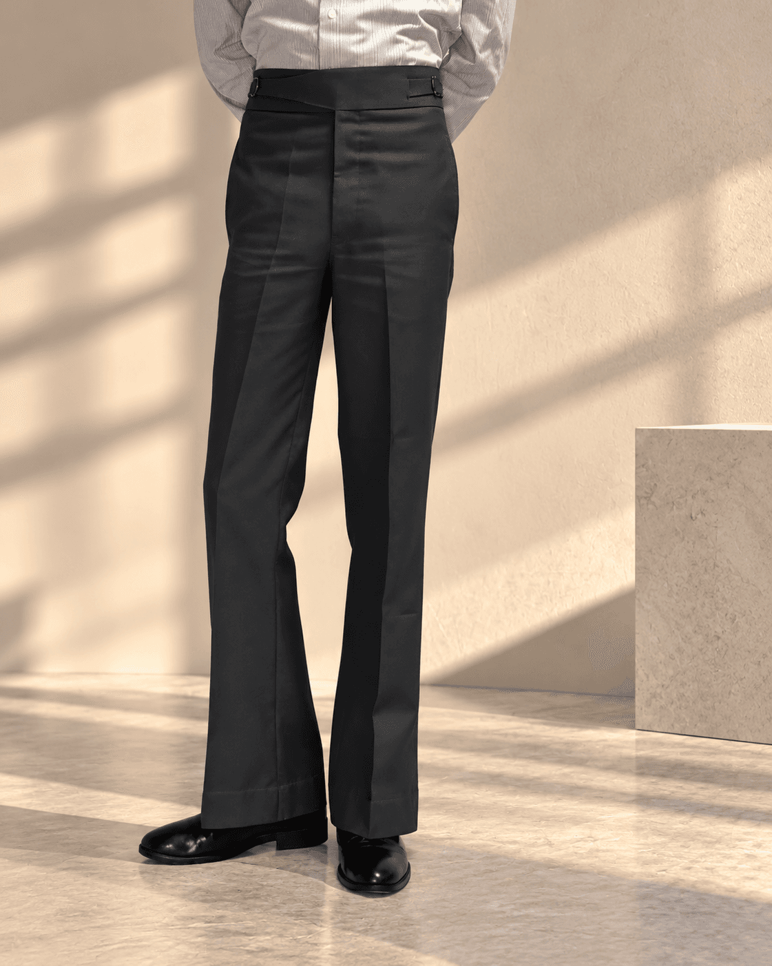 Grey Gurkha Flare — front on sunlit stone
